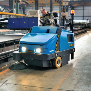 Magnum Ride On Sweeper cleaning a factory floor